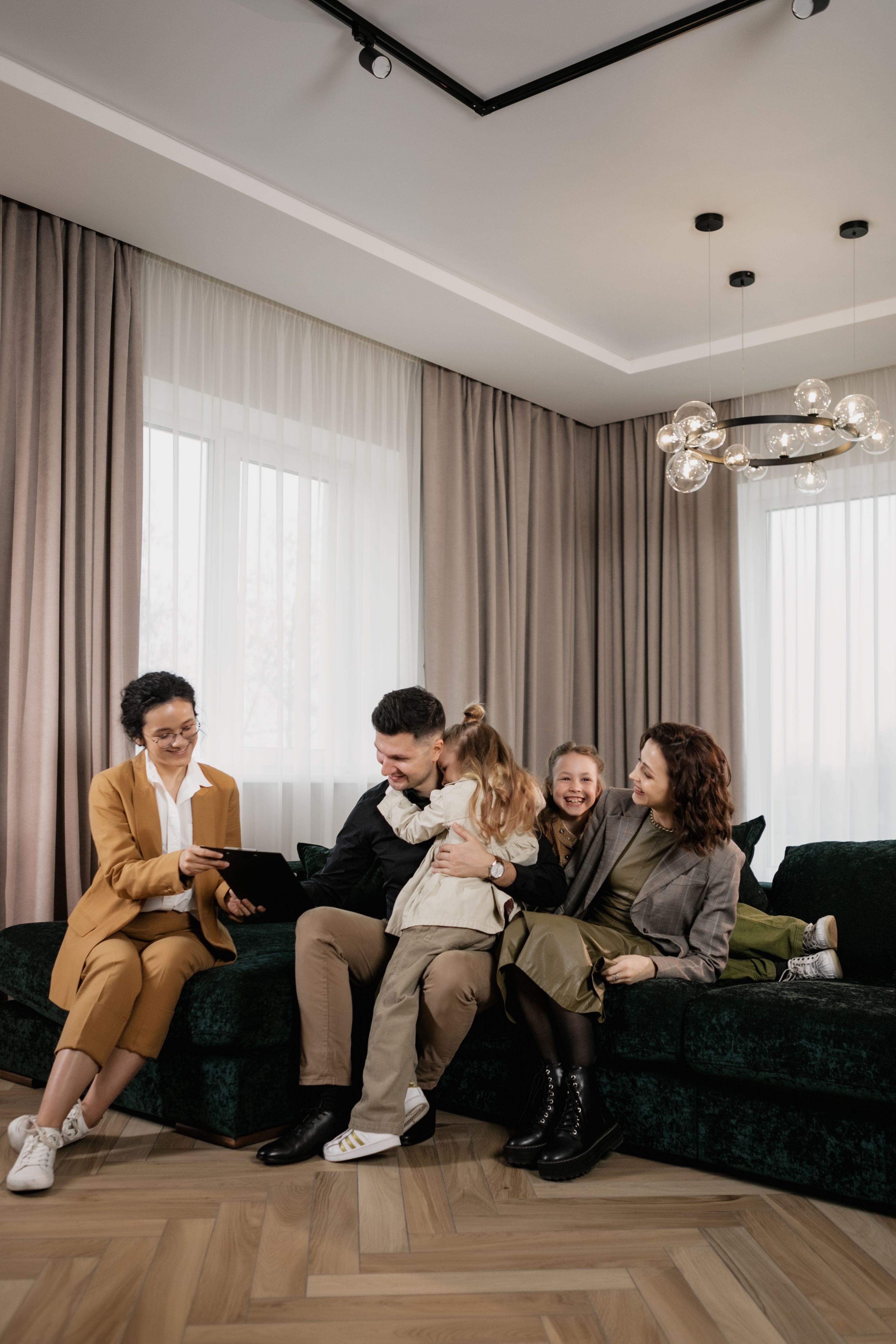 A licensed advisor sitting with a family in their living room, going through options together